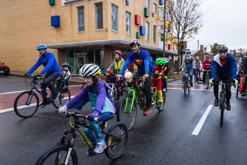 "Families on a bike ride in a Virginia neighborhood"