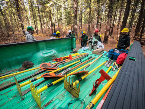 trail tools in the bed of a green truck
