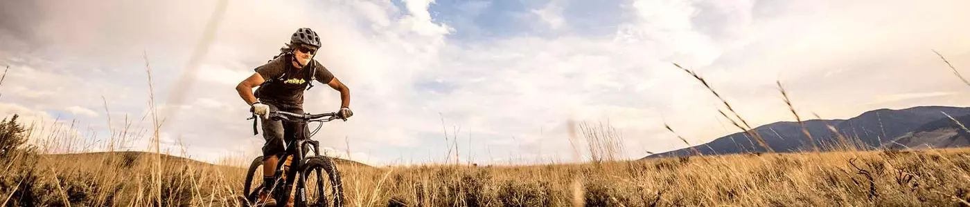mountain biker riding in a field
