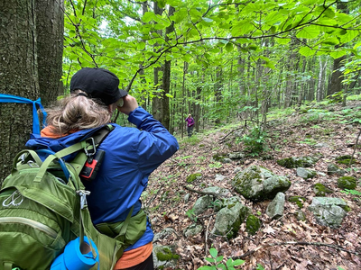 IMBA Trail Solutions planners using clinometer to measure trail pitch in Rib Mountain State Park. 