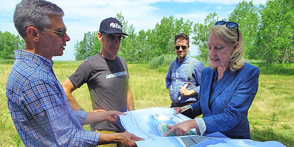 Group contemplating trail design in 2017. 