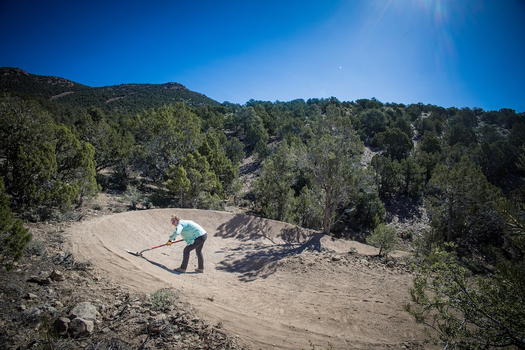IMBA Trail Solutions staff constructing berm on trail in Pioche, NV. 